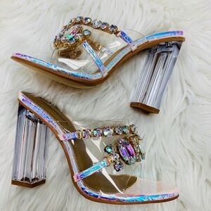 Mermaid iridescent patterned chunky clear heeled mule with a gem embellishment.